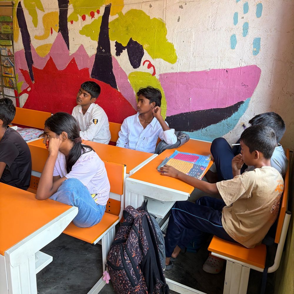 Children working at their desks in maths class